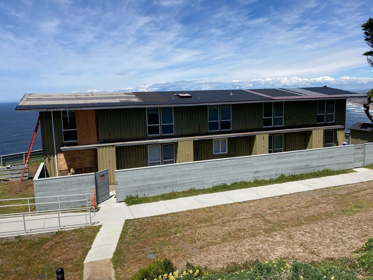 Wide view of the Coast Guard station building, showing the full commercial exterior